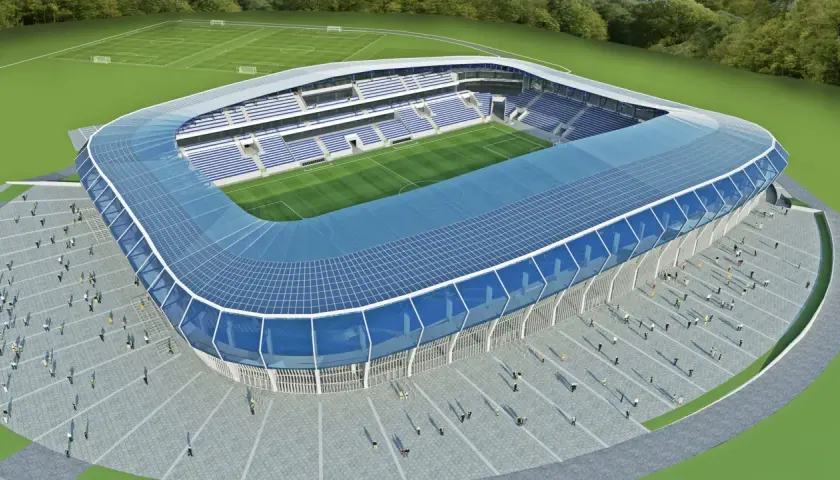 Nowoczesny stadion Wisły Płock z niebieskim dachem i trybunami. Obiekt ma imponującą pojemność, gotowy na przyjęcie kibiców.